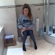 A British girl is recorded by her friend as she begins to shit while sitting on a toilet. Some crackling and plops are heard, and they laugh at the sounds. Over half a minute.